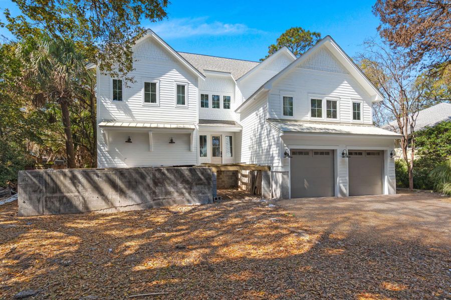 Front exterior of a new home in , Isle Of Palms, SC, highlighting curb appeal (Image 13).