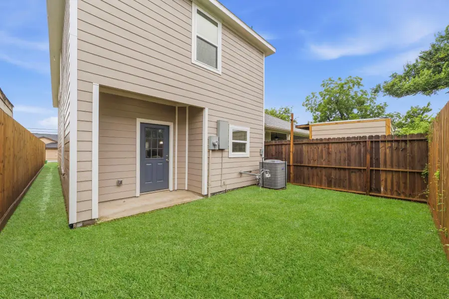 Covered back patio perfect for outdoor entertainment.