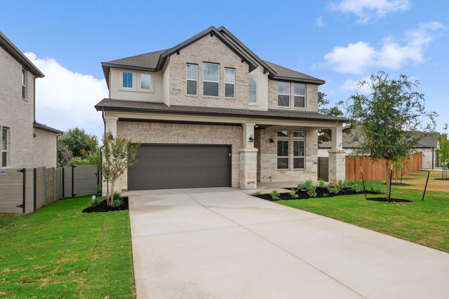 Front exterior of a new home in Wolf Ranch, Georgetown, TX, highlighting curb appeal (Image 27).