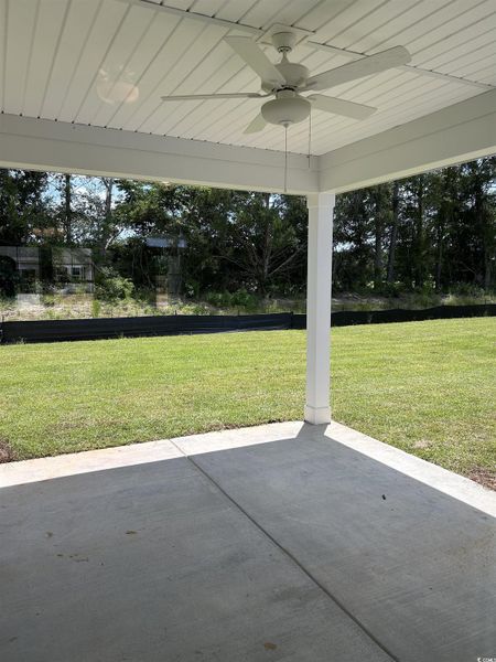 View of patio with a ceiling fan