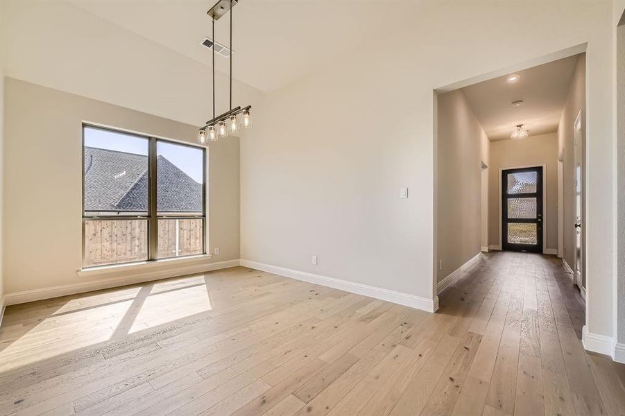 Unfurnished dining area featuring light hardwood / wood-style flooring