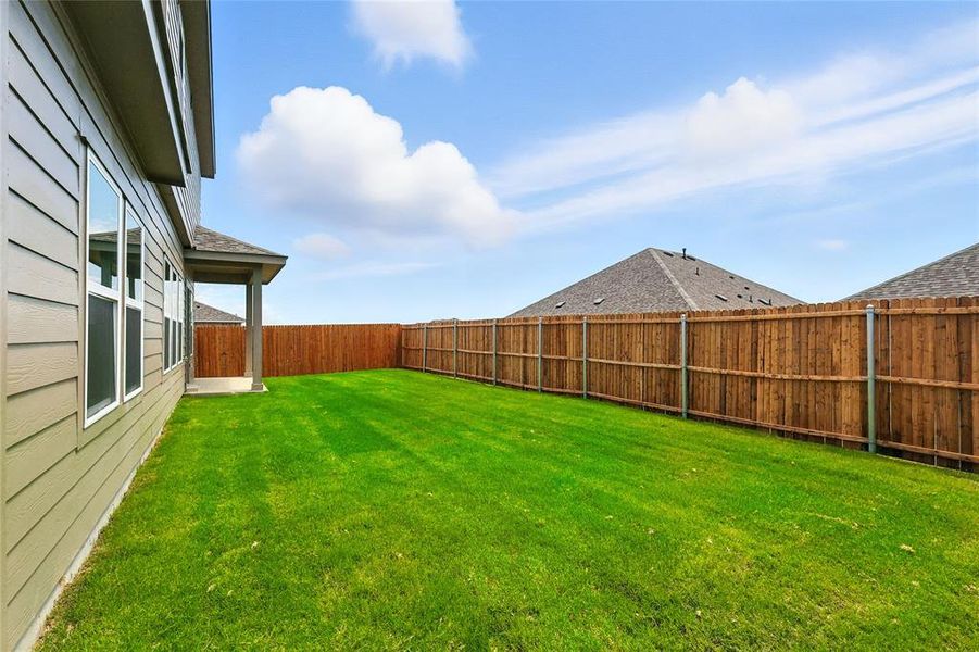 Fenced backyard featuring a patio Fenced backyard featuring a patio