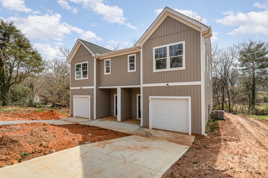 Front exterior of a new home in , Statesville, NC, highlighting curb appeal (Image 15).
