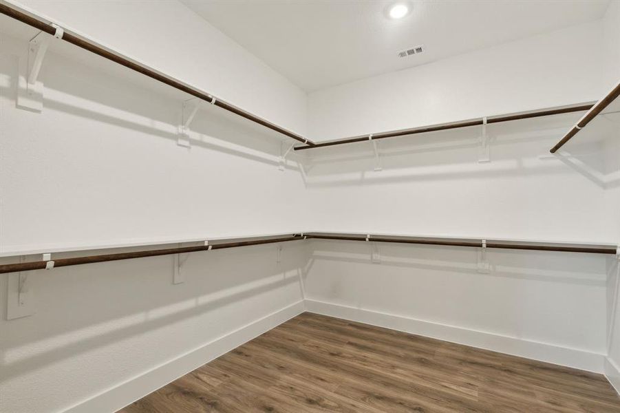 Unfurnished living room featuring light wood-type flooring and ceiling fan