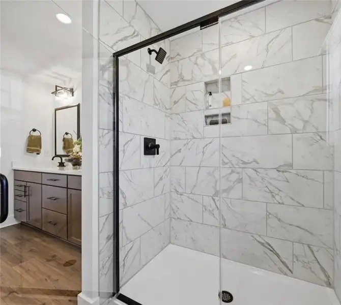 A well-appointed bathroom features a spacious show A well-appointed bathroom features a spacious show