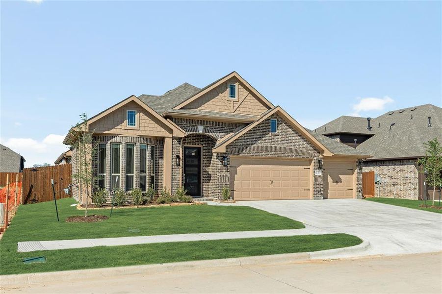 Front exterior of a new home in Hampton Park, Glenn Heights, TX, highlighting curb appeal (Image 2).