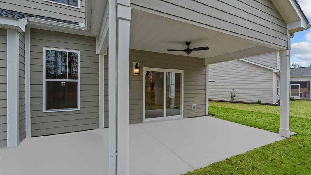 Exclusive rear covered porch with accomplished detail and elevated outdoor living potential