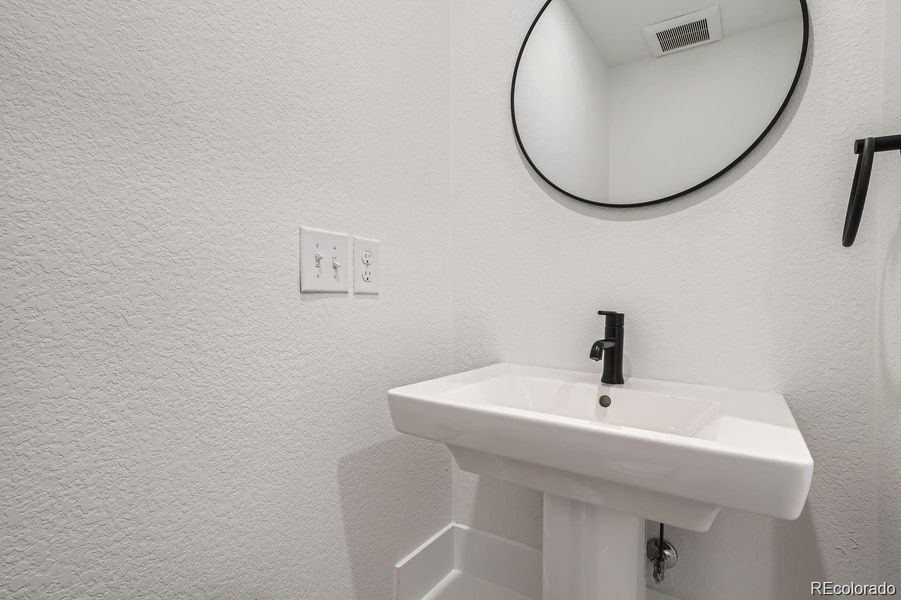Powder room on entry level for easy access to the flex space.