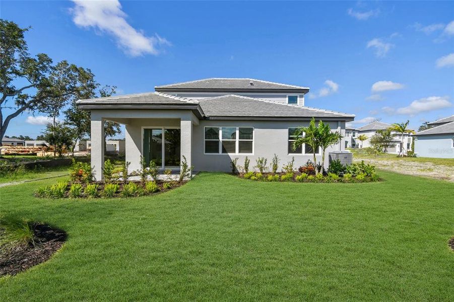 Exterior details and patio area of a home in Hawkstone, Sarasota (Image 2). Exterior details and patio area of a home in Hawkstone, Sarasota (Image 2).