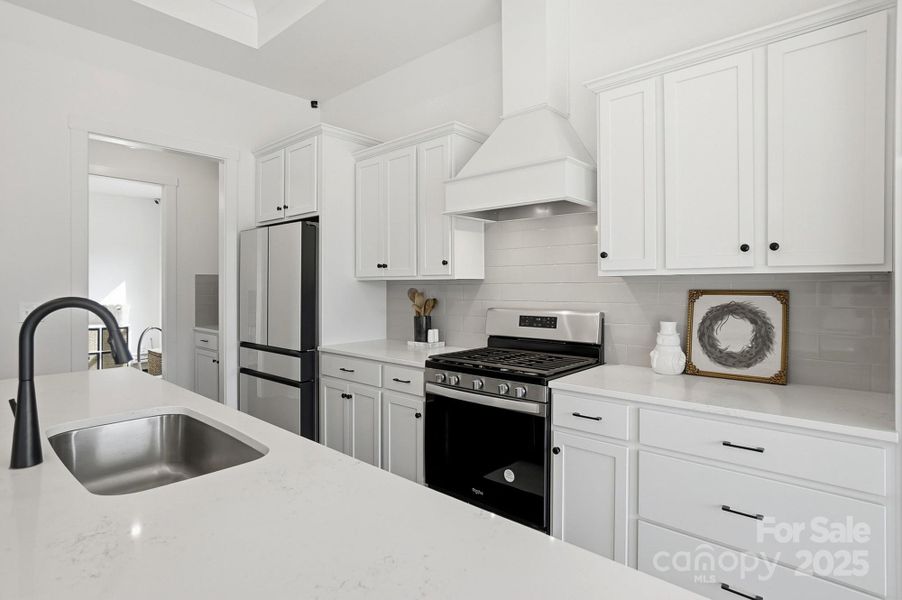 Open Kitchen with Quartz Countertops and Large Island