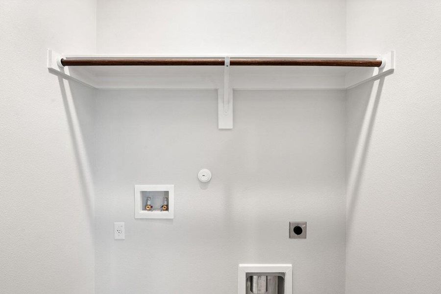 Laundry area with gas dryer hookup, hookup for an electric dryer, and washer hookup