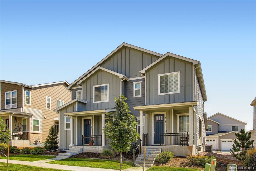 Front exterior of a new home in Haskins Station, Arvada, CO, highlighting curb appeal (Image 22).