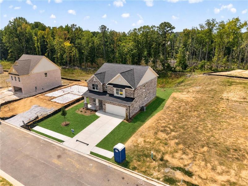 Front exterior of a new home in , Loganville, GA, highlighting curb appeal (Image 31).