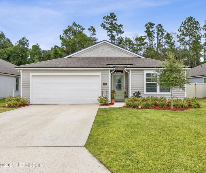 Front exterior of a new home in Dorado at Entrada, St. Augustine, FL, highlighting curb appeal (Image 26).
