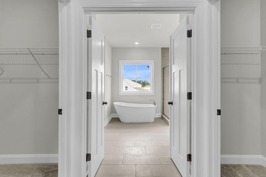 Spacious, unfurnished interior of a new home in Tidewater at Lakes of Cane Bay, Summerville (Image 51).