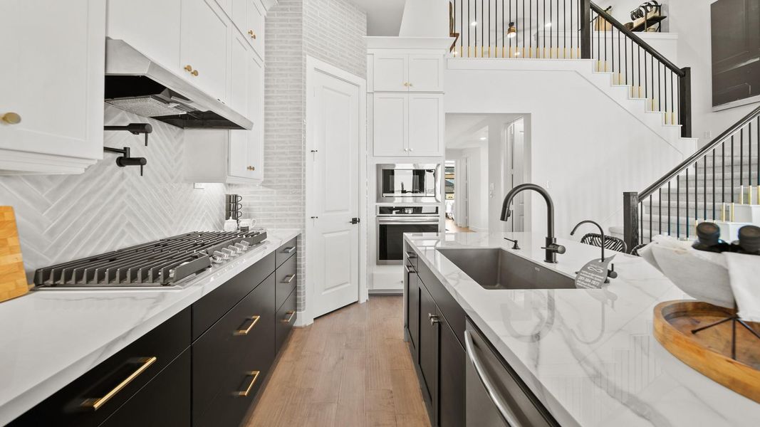 Upgraded stainless steel built-appliances include a 5 burner gas cooktop, venthood, microwave, oven, dishwasher, and even a refrigerator! Upgraded stainless steel built-appliances include a 5 burner gas cooktop, venthood, microwave, oven, dishwasher, and even a refrigerator!