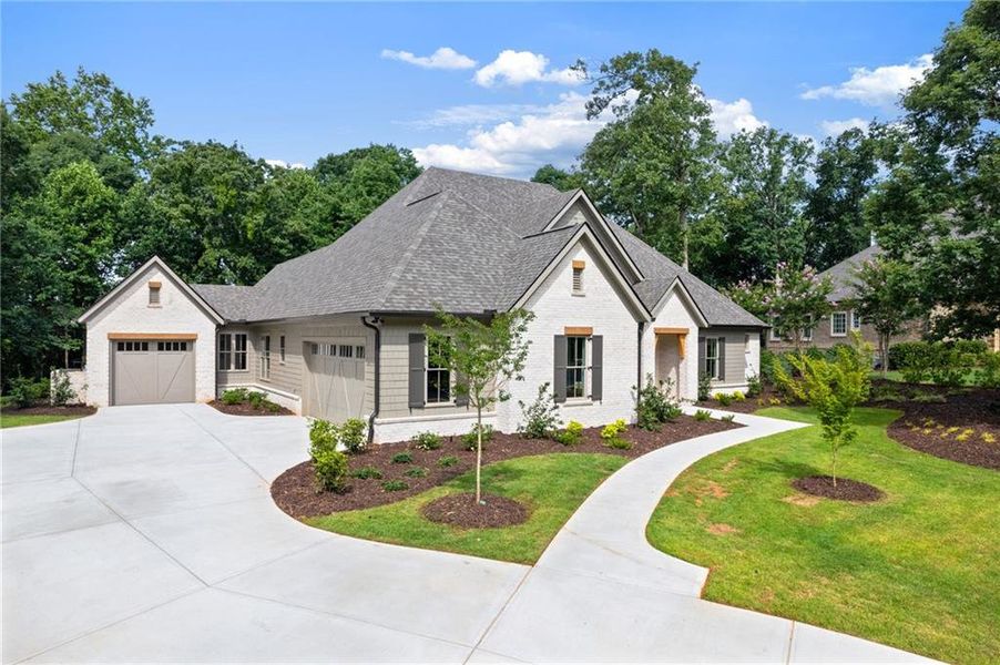 Front exterior of a new home in , Flowery Branch, GA, highlighting curb appeal (Image 32).