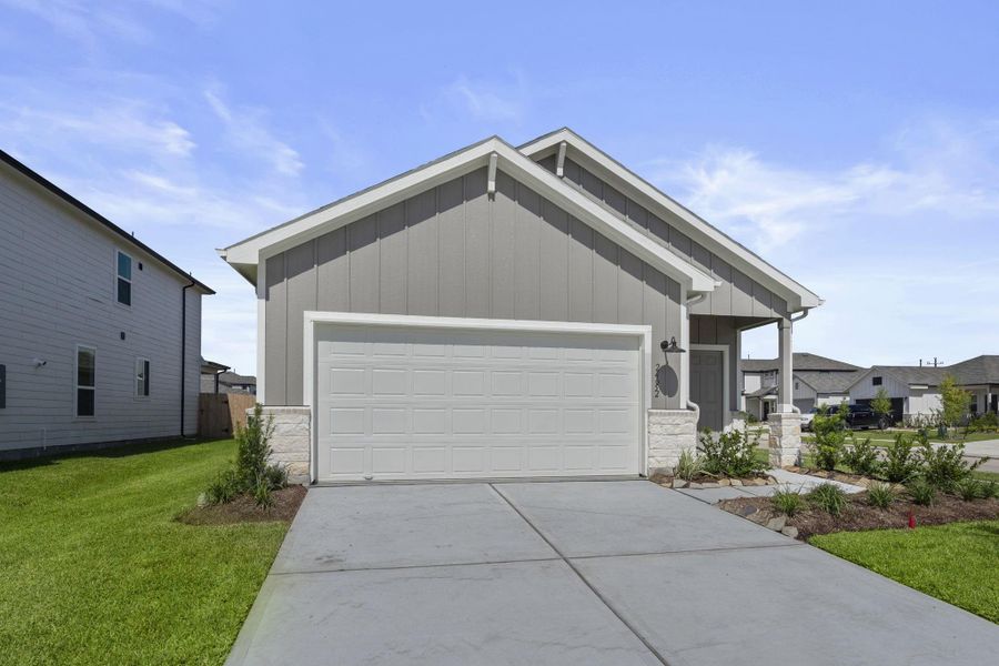 Front exterior of a new home in Peppervine, Porter, TX, highlighting curb appeal (Image 12).