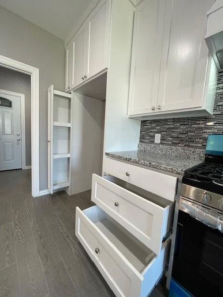 Kitchen features large pullout drawers for storage Kitchen features large pullout drawers for storage