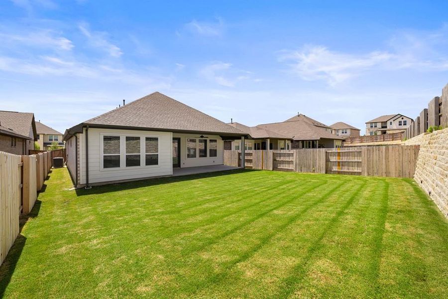 Front exterior of a new home in Park Collection at Lariat, Liberty Hill, TX, highlighting curb appeal (Image 25). Front exterior of a new home in Park Collection at Lariat, Liberty Hill, TX, highlighting curb appeal (Image 25).