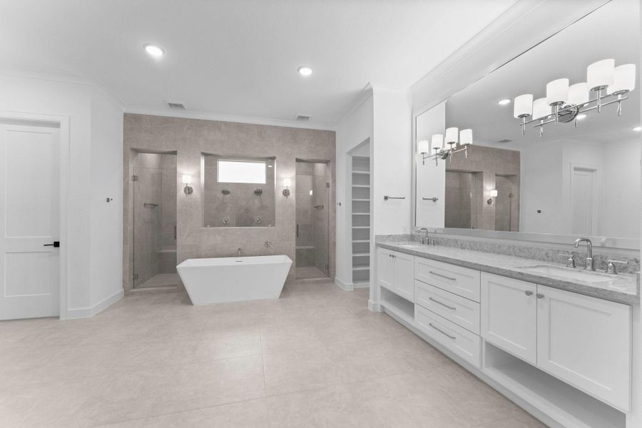 Primary bathroom features a freestanding tub, dual walk-in showers, and an expansive double vanity with elegant lighting. The neutral color palette and ample natural light create a serene atmosphere. Primary bathroom features a freestanding tub, dual walk-in showers, and an expansive double vanity with elegant lighting. The neutral color palette and ample natural light create a serene atmosphere.