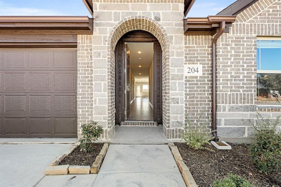 Exterior details and patio area of a home in East Oak Creek Elements, Commerce (Image 3).