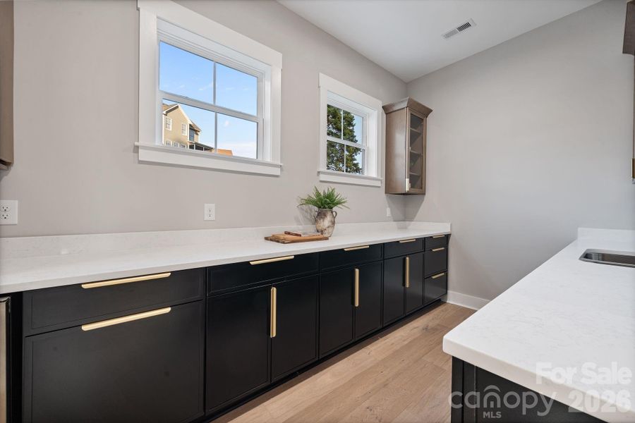 Scullery features, sink, and additional dishwasher