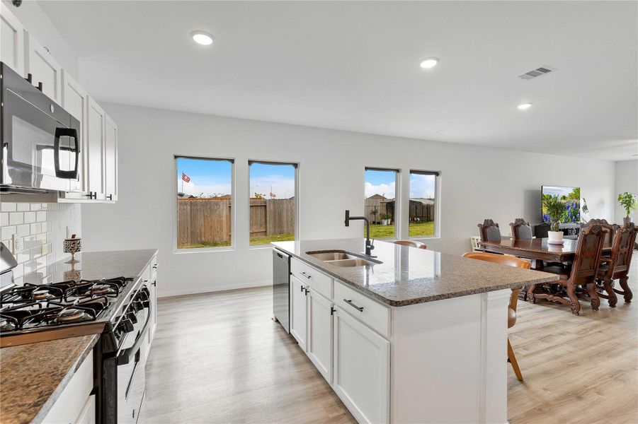 Furnished interior view inside a new home in Sweetgrass Village, Crosby (Image 5).