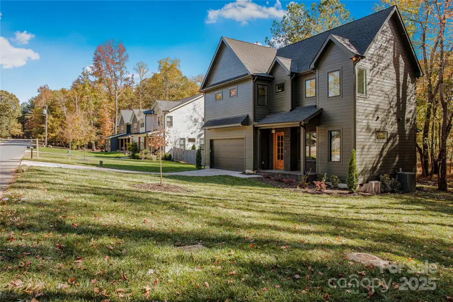 Front exterior of a new home in , Matthews, NC, highlighting curb appeal (Image 2).