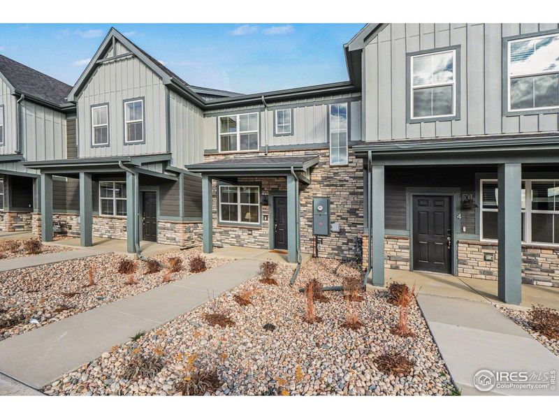 Front exterior of a new home in Poudre Heights: The Meadow Collection, Windsor, CO, highlighting curb appeal (Image 27).