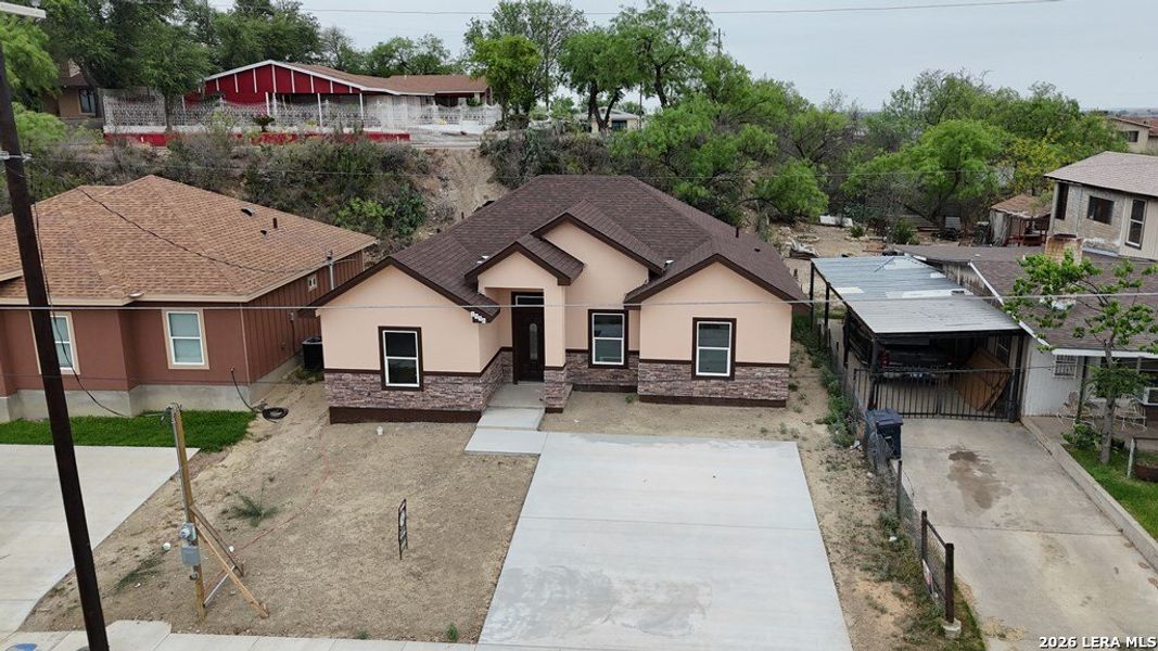 Front exterior of a new home in , Eagle Pass, TX, highlighting curb appeal (Image 16). Front exterior of a new home in , Eagle Pass, TX, highlighting curb appeal (Image 16).
