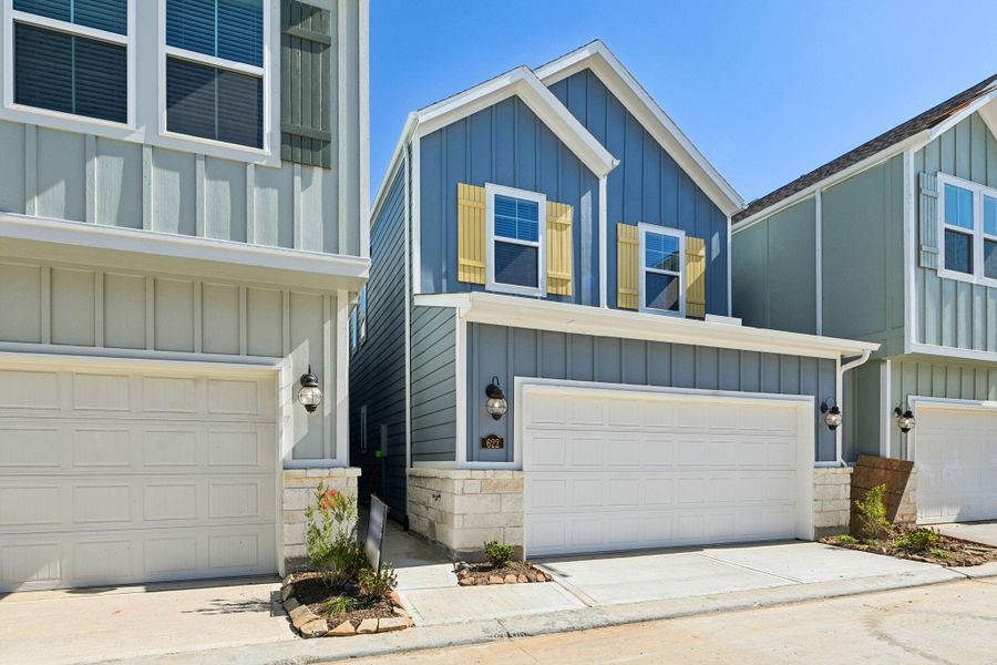 Front exterior of a new home in Kemah Crossing - City Series, Kemah, TX, highlighting curb appeal (Image 2). Front exterior of a new home in Kemah Crossing - City Series, Kemah, TX, highlighting curb appeal (Image 2).