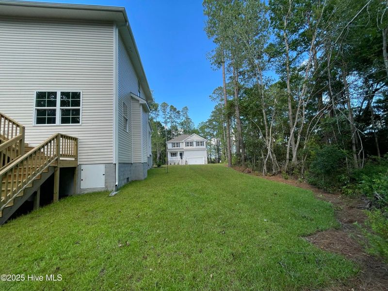Front exterior of a new home in Mill Creek Cove, Bolivia, NC, highlighting curb appeal (Image 16).