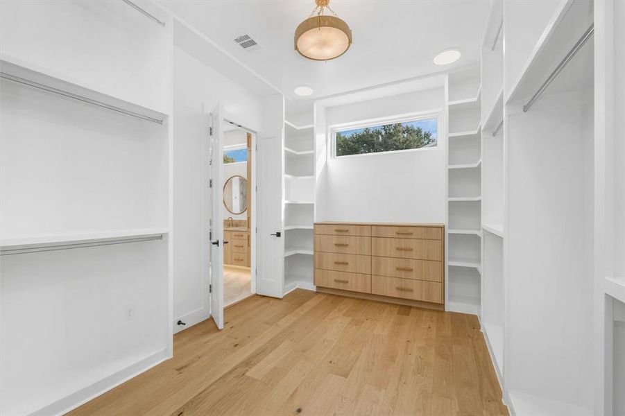 Spacious closet featuring light wood finished floors