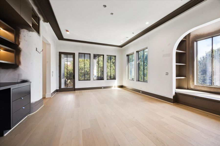 Upstairs gameroom with built-ins and window seat with bookshelves.