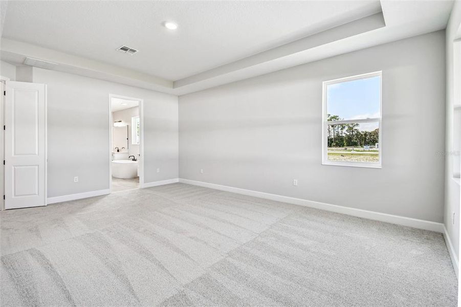 Spacious, unfurnished interior of a new home in Solace at Corner Lake, Orlando (Image 26).