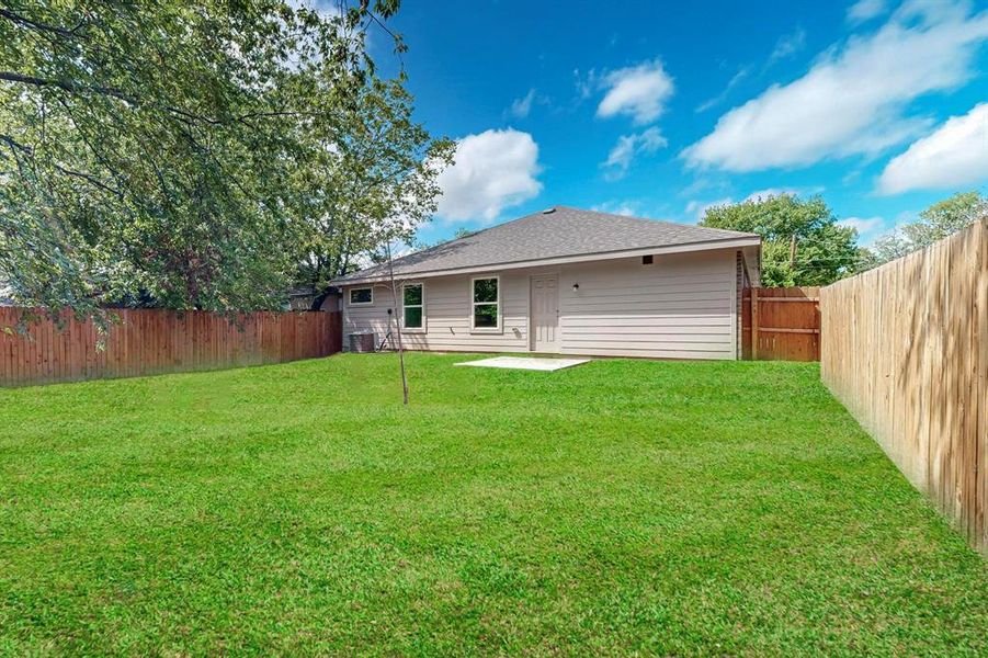 View of yard featuring central AC unit and a patio area