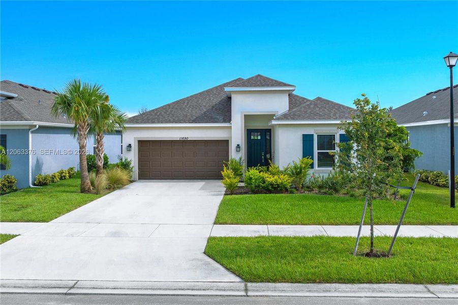 Front exterior of a new home in , Port St. Lucie, FL, highlighting curb appeal (Image 1). Front exterior of a new home in , Port St. Lucie, FL, highlighting curb appeal (Image 1).