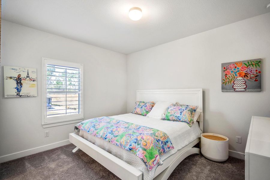 One of two secondary bedrooms on the 2nd level. This one includes an en-suite bathroom.