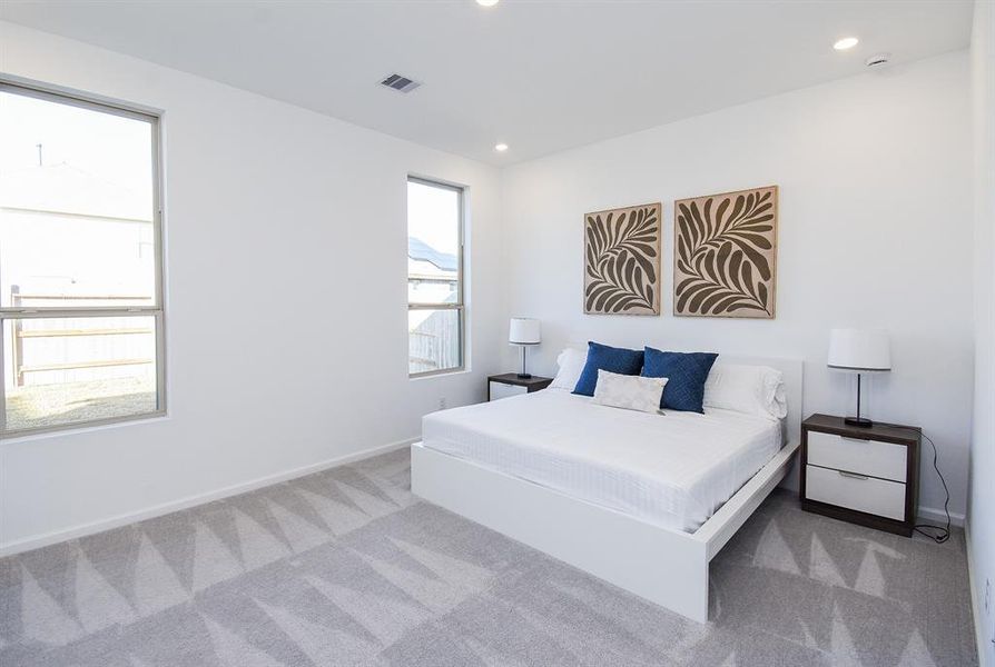 Incredible wall and carpeted floors space are yours to love and fill in a bright primary suite.