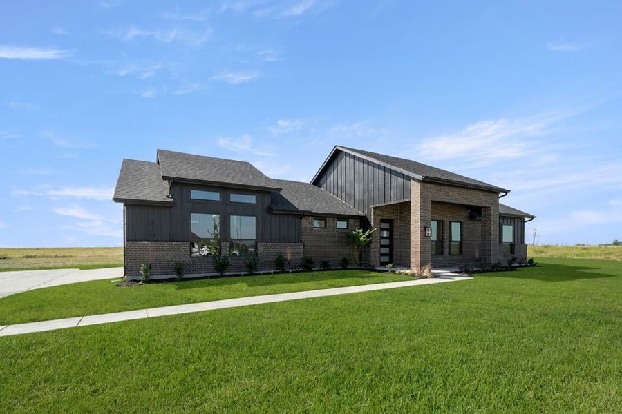 Front exterior of a new home in Carrera Ranch, Waxahachie, TX, highlighting curb appeal (Image 2).