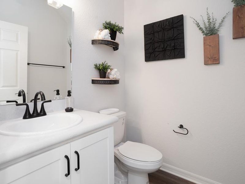 Convenient downstairs powder room - Aria home plan by Highland Homes