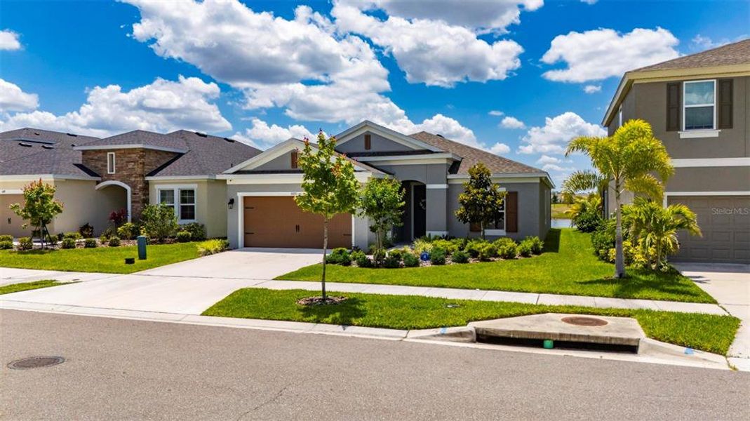 Front exterior of a new home in , Apollo Beach, FL, highlighting curb appeal (Image 23).