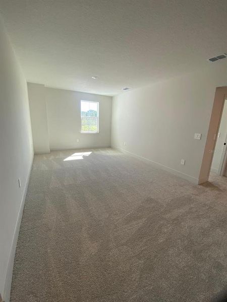 Spacious, unfurnished interior of a new home in Summerlake Reserve, Winter Garden (Image 13).