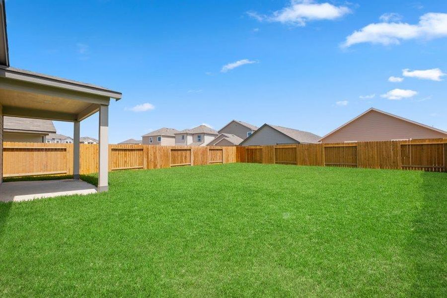 Step into this oversized backyard, perfect for outdoor entertaining or relaxing in a private retreat. The lush, fully sodded lawn is enclosed by a 6-foot cedar privacy fence, creating a safe and secure space for gatherings or play.