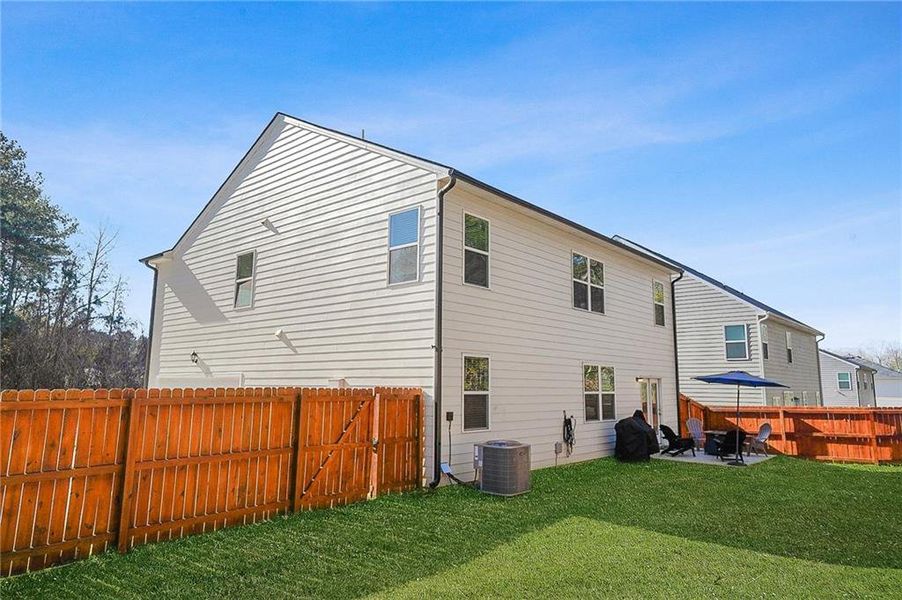Exterior details and patio area of a home in The Greens at Thompson Creek, Hampton (Image 4).
