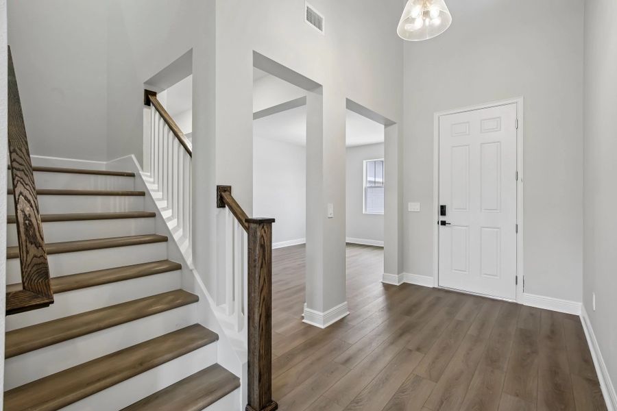 The open spindle staircase welcomes you up to the secondary bedrooms