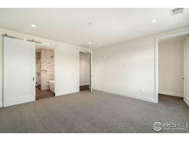 Primary bedroom with ensuite and large, walk-in closet.