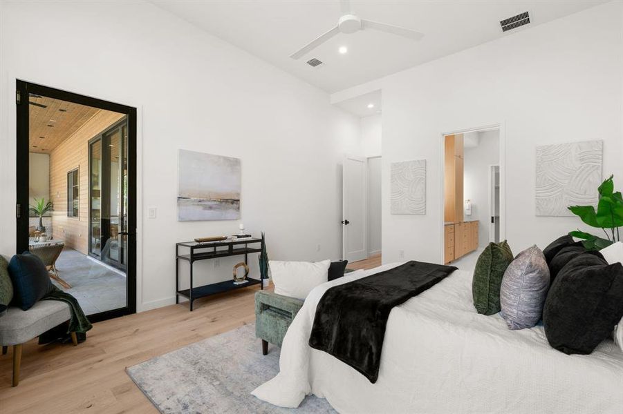 The primary suite includes direct access to the covered patio and pool area.