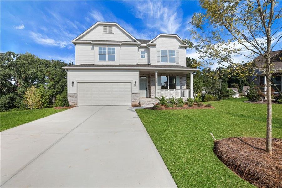 Front exterior of a new home in Cambridge, Flowery Branch, GA, highlighting curb appeal (Image 27). Front exterior of a new home in Cambridge, Flowery Branch, GA, highlighting curb appeal (Image 27).